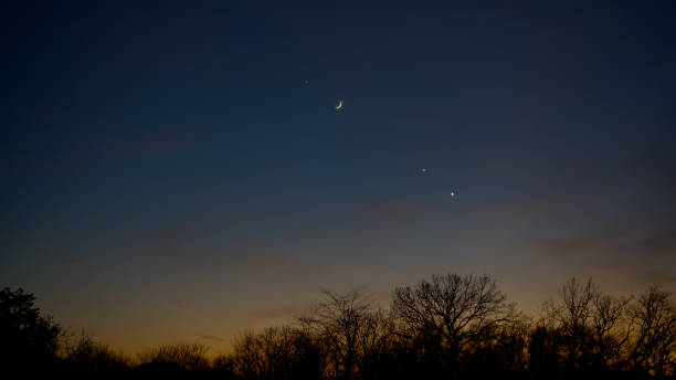 istock Crescent young Moon with stars, planets and countryside silhouettes. 2192247021
