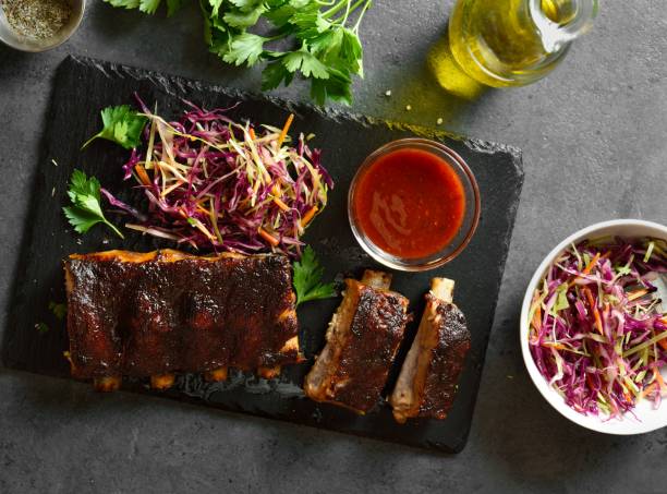istock Spicy grilled spare ribs served with cabbage salad and sauce 2192247478