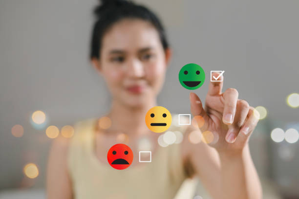 istock Customer hand and smiling face selecting check mark showing feedback with smiley face symbol, service evaluation, satisfaction concept. 2192250089
