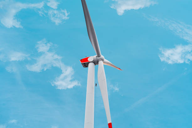 istock Windtech Maintenance Worker Inspecting a Renewable Energy Wind Turbine By Visual Evaluation of the Rotor Blades 2192251281