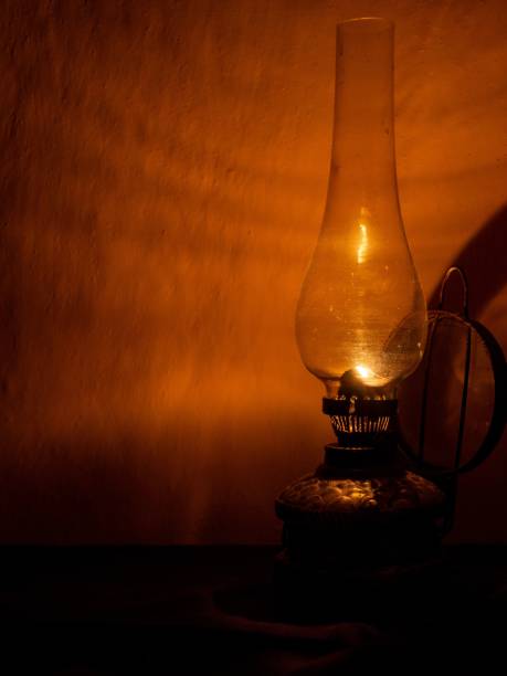 istock Vintage Oil Lamp Casting Warm Glow 2192251972