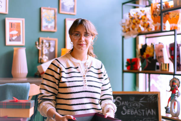 istock Small business owner preparing gift box in her shop 2192253526