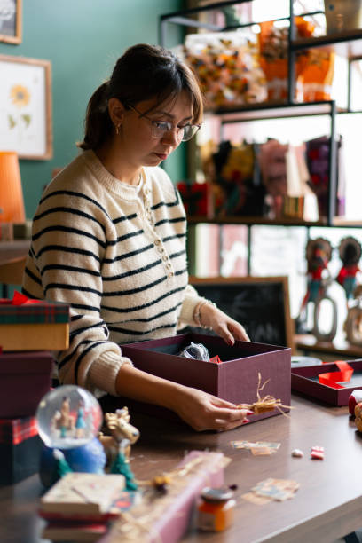 istock Small business owner preparing gift boxes for christmas holidays 2192254024