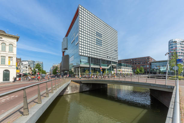 Utrecht, the Netherlands. 17 May 2024. TivoliVredenburg music center building in Utrecht. With canal and bridges in the foreground.