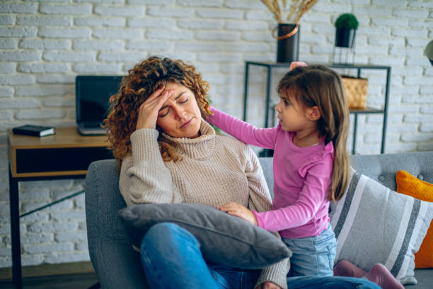 istock Worried little daughter comforting depressed mom 2192257838