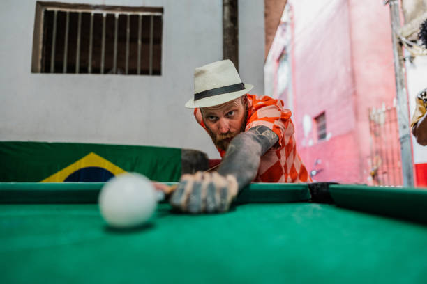 Female friends playing pool in a pool hall