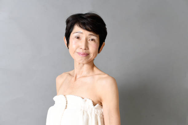 istock Smiling middle-aged Asian woman looking at camera 2192259324