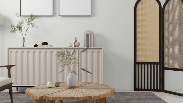 istock A minimalist living room interior featuring a wooden coffee table, a decorative sideboard with vases and plants, and a woven room divider. 3d rendering 2192260606