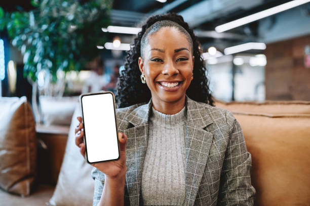 Business woman showing blank smartphone screen