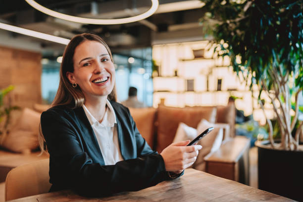istock Businesswoman using smartphone at coworking workplace 2192261282