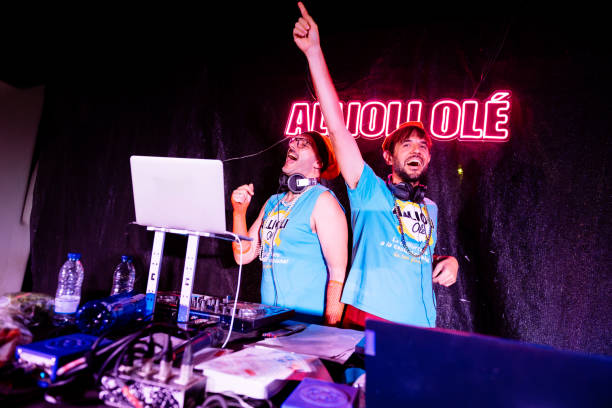 istock Two djs playing music at a nightclub party 2192261997