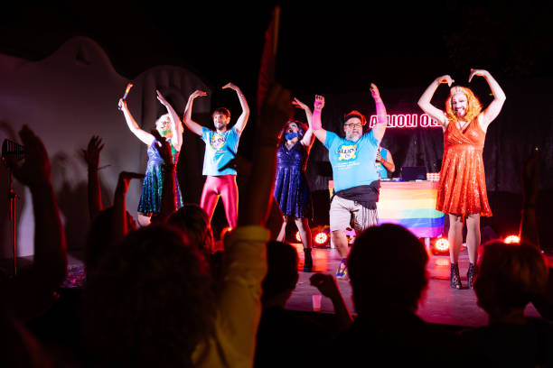 istock Drag queens and activists dancing on stage during a pride event, entertaining a cheering crowd 2192262072