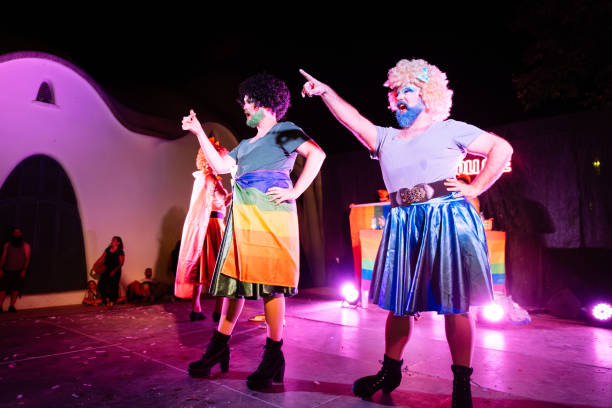 istock Drag queens performing on stage with rainbow flag at night 2192262697