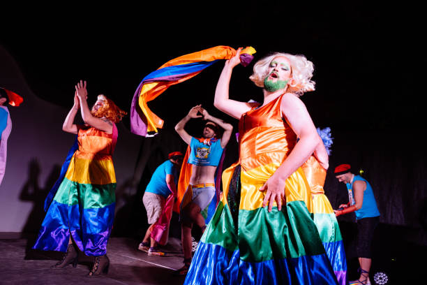 istock Vibrant Drag Queens Perform Energetically While Celebrating Pride With Colorful Flags at a Nighttime Festival 2192262787