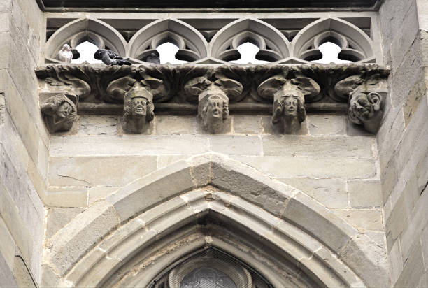 Intricate stonework adorns a historic facade in Carcassonne, France, showcasing artistry.