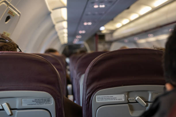 istock Interior of airplane with passengers on seats waiting to take off 2192263276