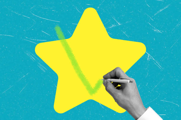istock Hand marks a green check on a bright yellow star against a vibrant blue background 2192263666