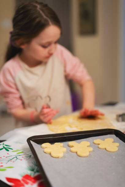 istock Girl Makes Cookies 2192265486