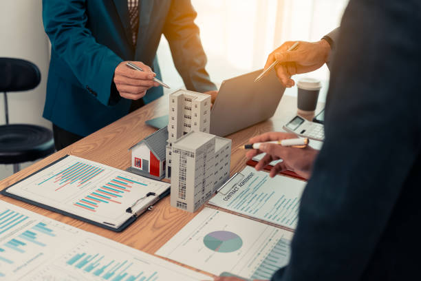 istock Real estate developers, architects and business teams working on a new business building project in a conference office highlight investment strategies and real estate decisions for future plans. 2192268249