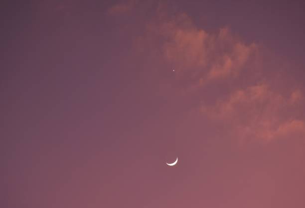 istock half moon and Venus on sky in twilight orange 2192269057