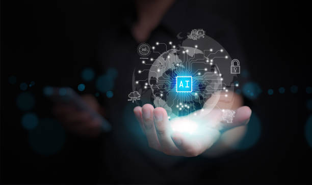 istock Artificial Intelligence concept. Hands of a man holds a virtual globe with AI text chip with circuit pattern and icons, glowing bright in the dark. Ai technology. 2192269627