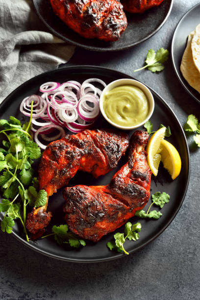 istock Tandoori chicken served with cilantro and onion 2192271391