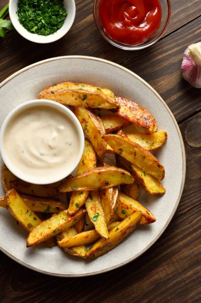 istock Baked potato wedges served with sauce 2192271442