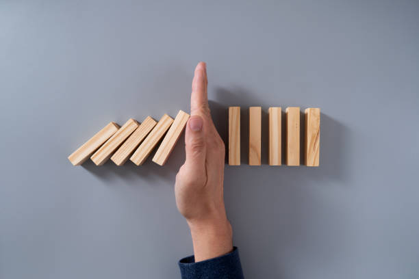 istock Concept of stopping domino effect 2192272773