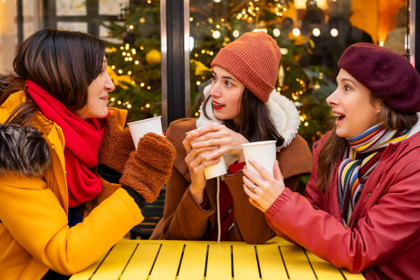 istock Women chatting over hot drinks outdoors 2192277357