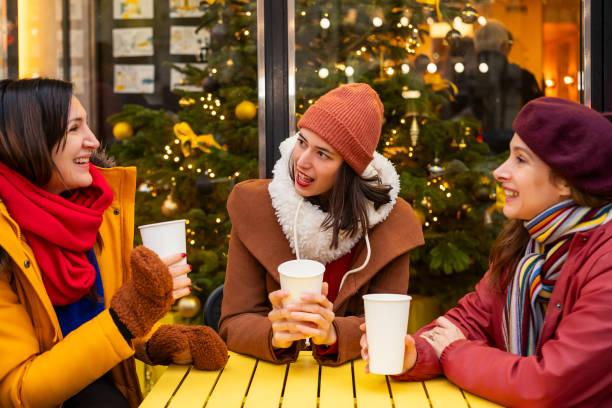 istock Women chatting over hot drinks outdoors 2192277377