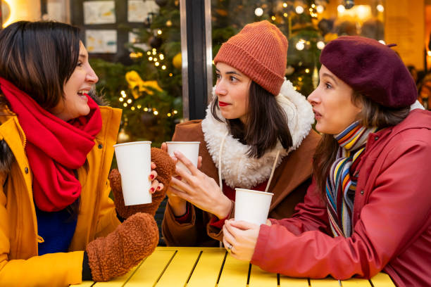 istock Women chatting over hot drinks outdoors 2192277395