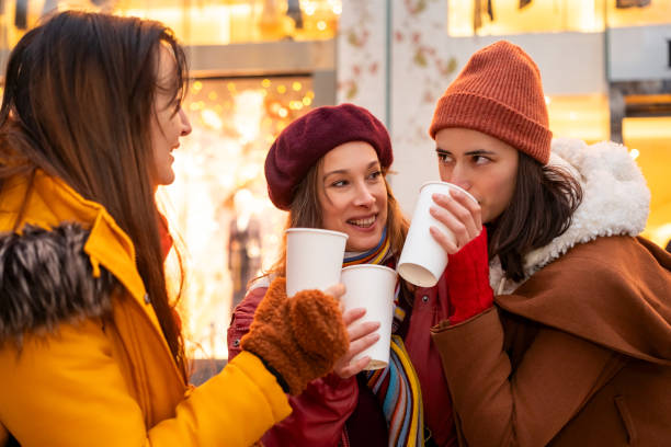 istock Women chatting over hot drinks outdoors 2192277401