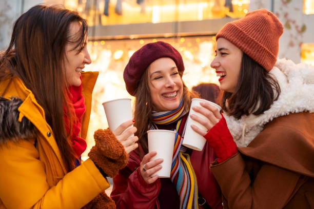 istock Women chatting over hot drinks outdoors 2192277430