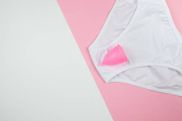 istock panties and menstrual cup on pink and white background with copy space top view 2192278623