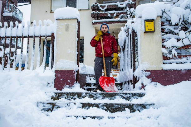 istock Man with snow shovel 2192279327