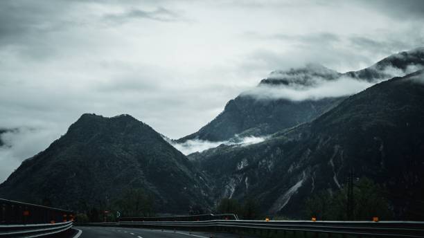 istock Scenic mountain road with misty peaks. 2192279983