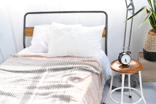 istock An image of a bedroom with sunlight shining through it 2192281093