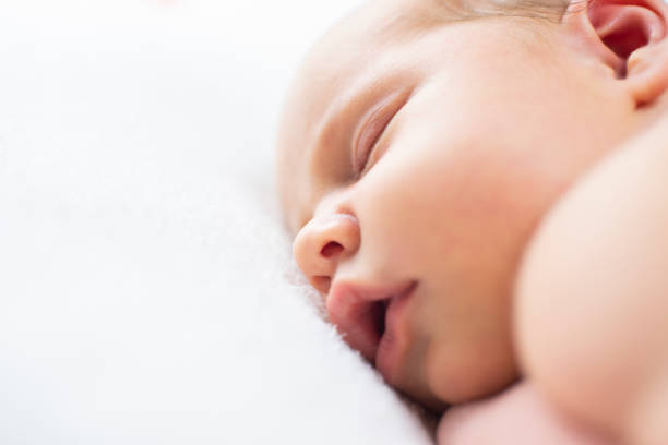 istock newborn baby, 17 days old, sleeping. 2192285185