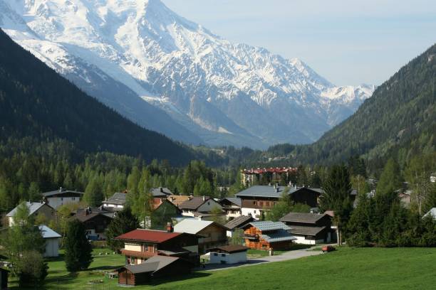 istock Alpine village with snow-capped mountains 2192285631