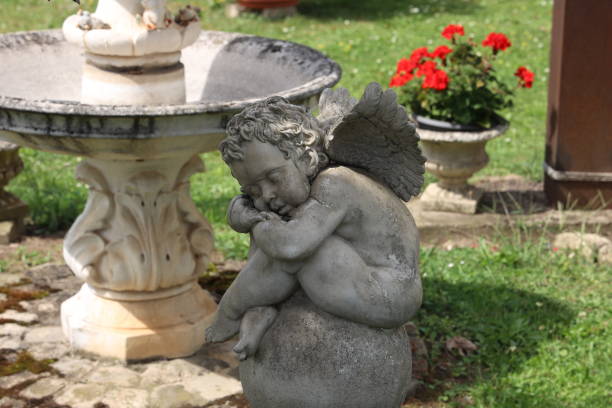 istock Sleeping angel figurine in the garden 2192285897