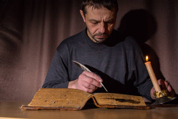 istock A European man reads an ancient book 2192285974