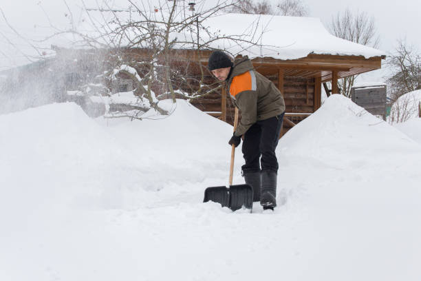 istock A European man removes snow 2192285993