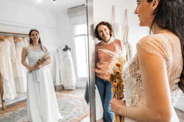 Bride with her mother in a bridal shop