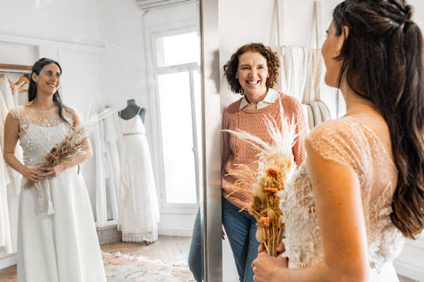 istock Bride with her mother in a bridal shop 2192286825