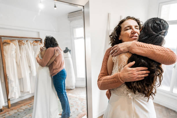 istock Bride embracing mother in a bridal shop 2192286838