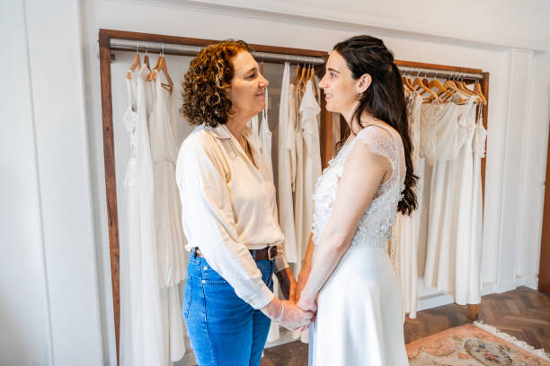 istock Bride talking with her mother in a bridal shop 2192286885