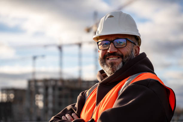 istock Confident Construction Worker Smiling at Job Site 2192288142