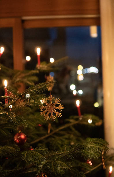istock Christmastree with red ornaments an candles 2192288255