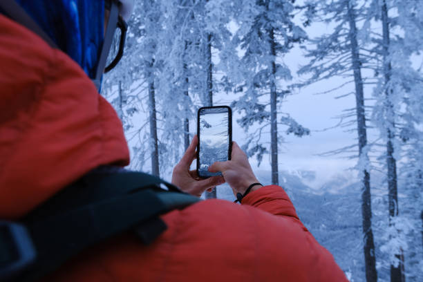 istock Portrait of backcountry skier using mobile phone in forest 2192288520