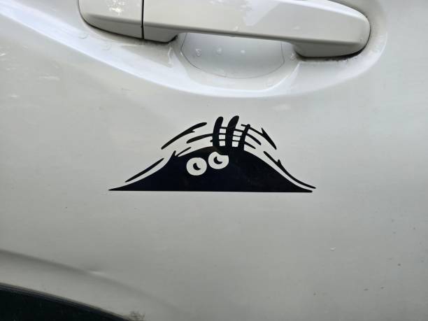 istock Eyeballs on car door 2192293660